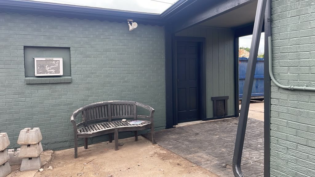 After: Denver metro · Painted brick patio entry · Deep sage green, black door