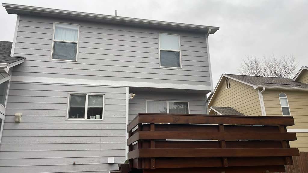 After: Denver metro · Two-story exterior repaint · Fresh gray, white trim